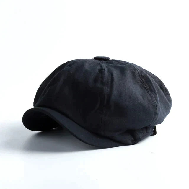 Octagonal herringbone newsboy cap with short brim and button top