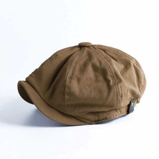Octagonal herringbone newsboy cap with short brim and button top