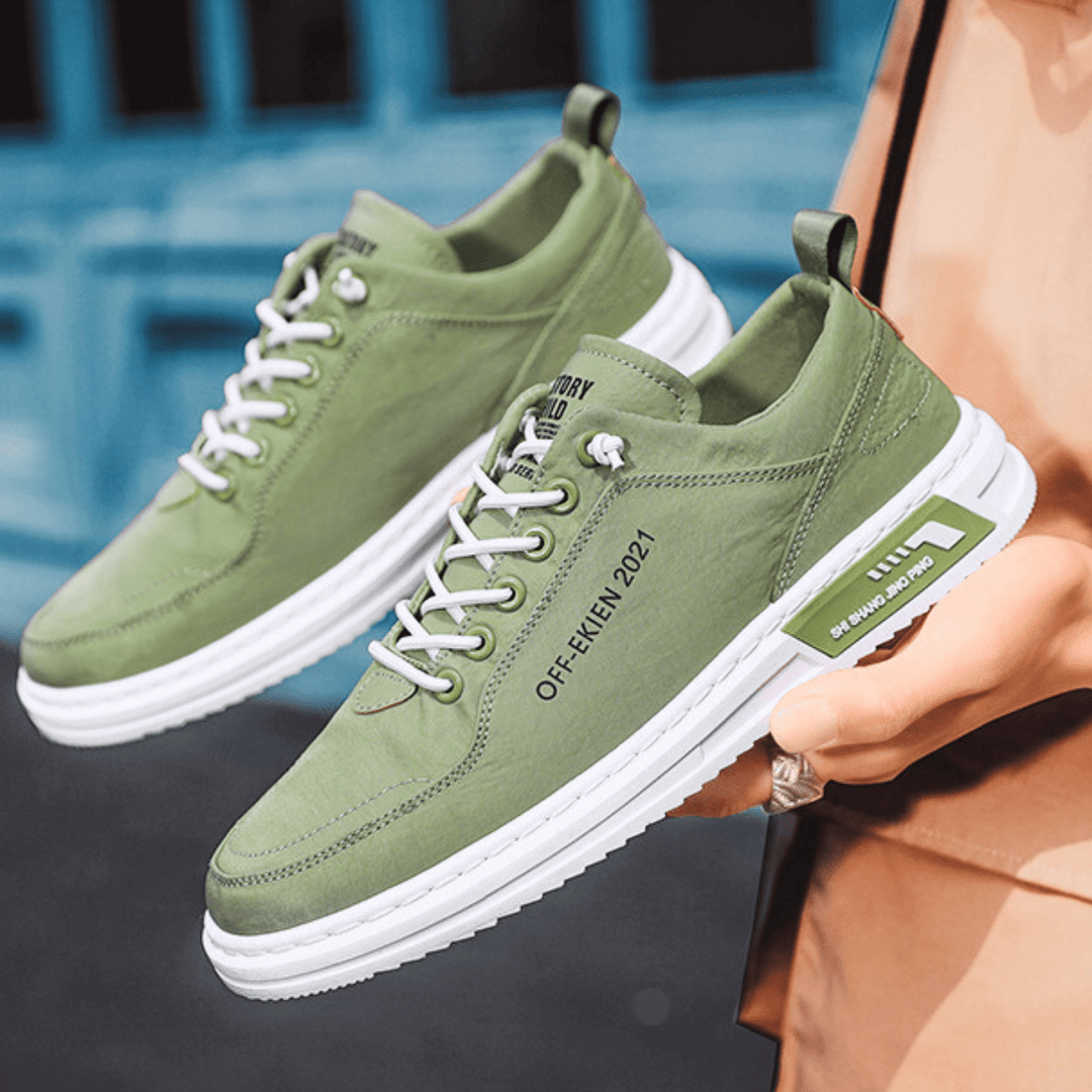 Low-top lace-up sneakers with stitched panels and contrast soles