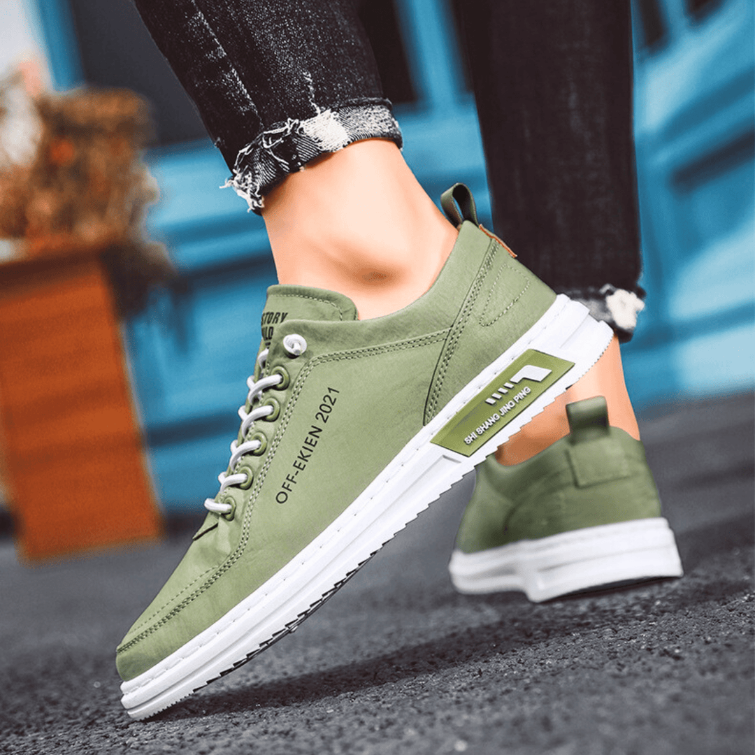 Low-top lace-up sneakers with stitched panels and contrast soles