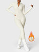 Women's fitted long-sleeve jumpsuit with mock neck and front zipper