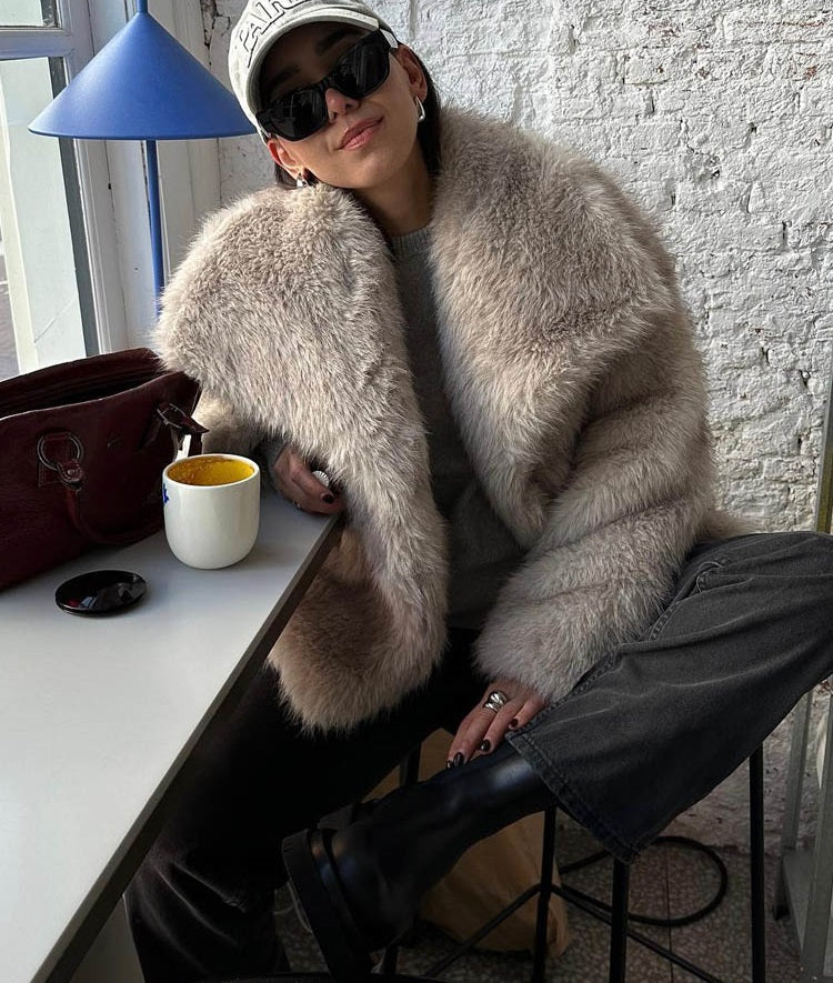 Women's beige faux fur jacket with wide collar and long sleeves